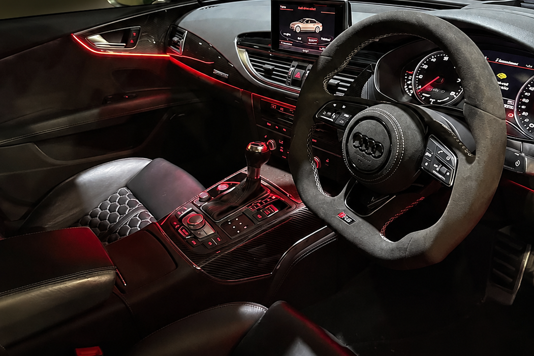 Audi interior with ambient lighting and suede steering wheel, collection banner for Audi interior parts