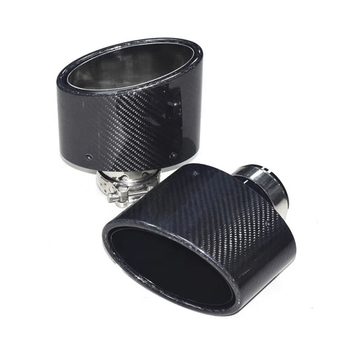 Two carbon fiber exhaust tips with a glossy woven texture and silver metal clamps