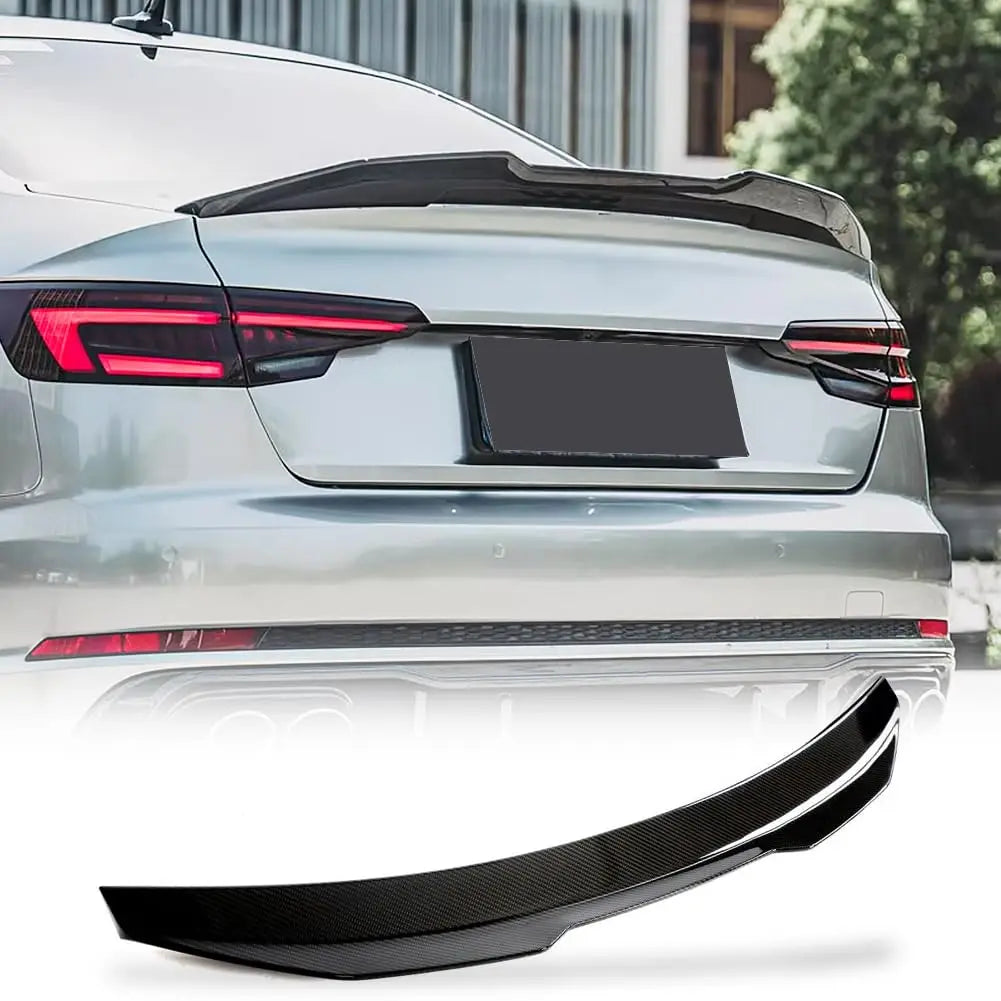 M4 style carbon fiber spoiler installed on grey Audi A4/S4 B8.5, rear three-quarter angle