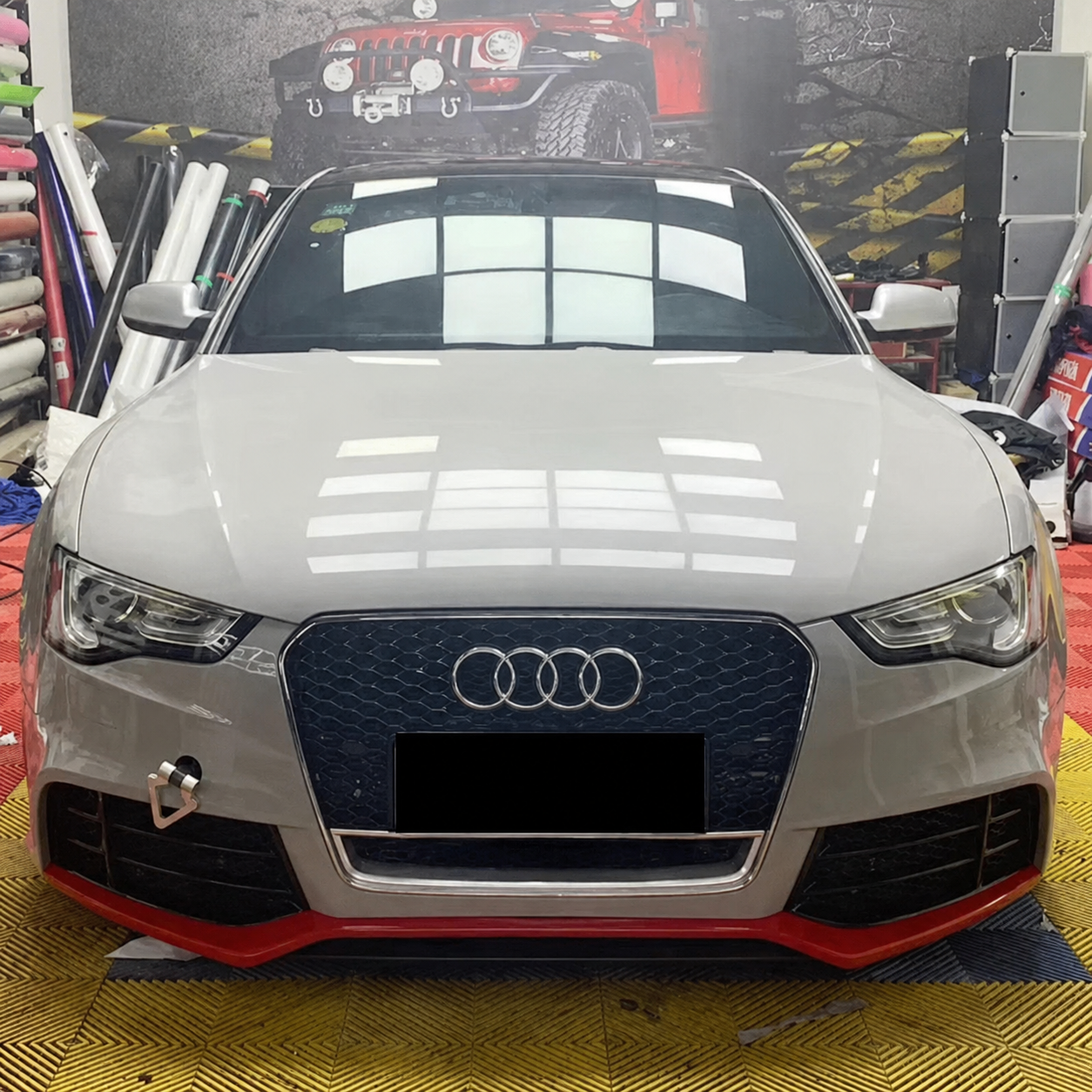 RS-style honeycomb grille installed on an Audi A5/S5 B8.5 in a workshop setting