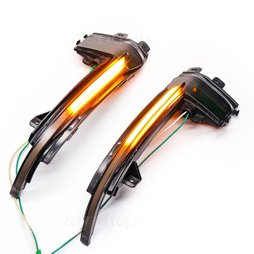 Smoked lens dynamic sequential mirror turn signal pair for Audi B8.5, lit amber showing sweeping LED strip