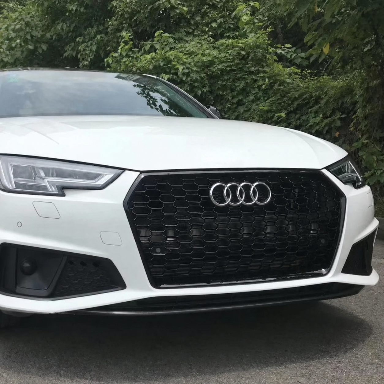RS style black honeycomb grille installed on a white Audi A4/S4 B9 front bumper